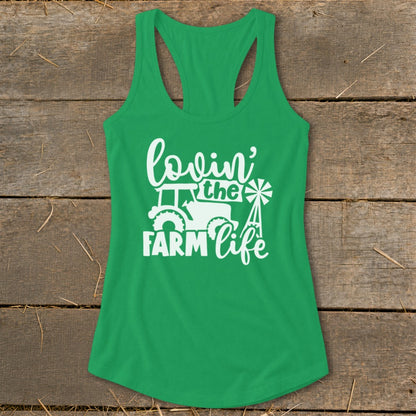 Green tank top with white "lovin' the farm life" graphic and tractor image.