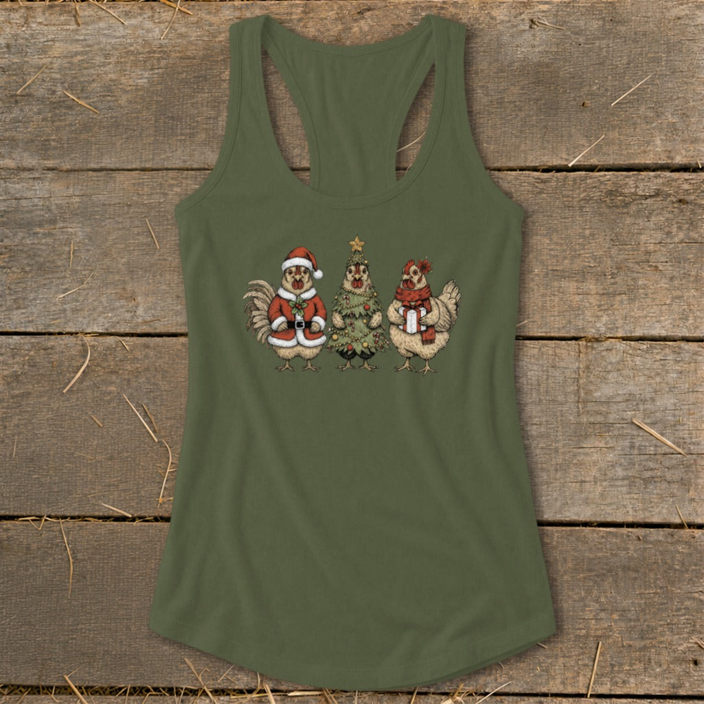 Three chickens dressed for Christmas: one as Santa, one as a tree, one with a scarf.