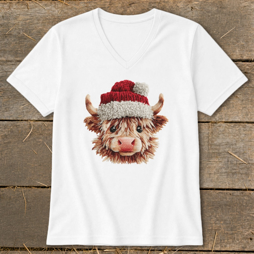 White v-neck t-shirt featuring a Highland cow wearing a Santa hat.