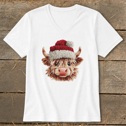 White v-neck t-shirt featuring a Highland cow wearing a Santa hat.