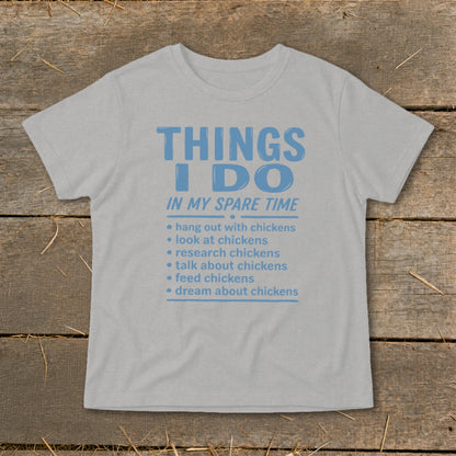 Light grey t-shirt with blue text listing chicken-related spare time activities.