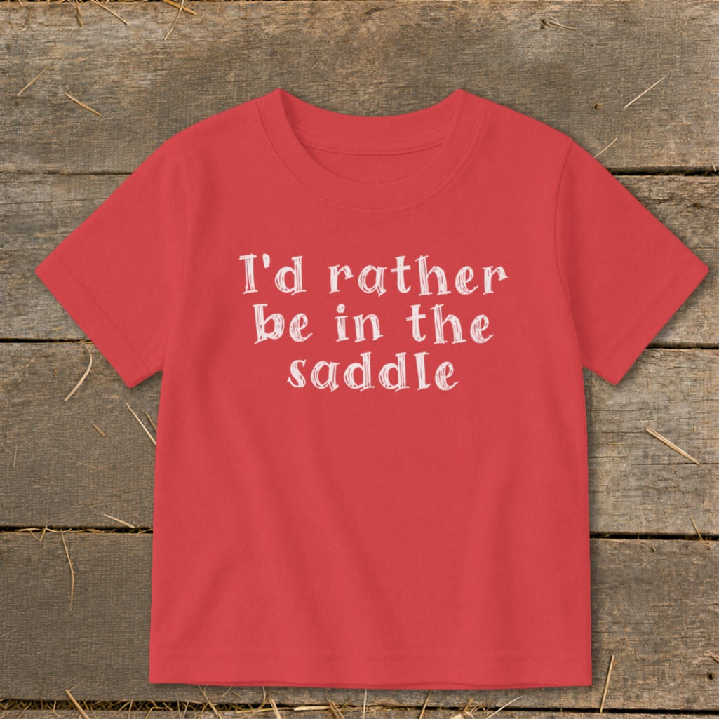 Red t-shirt with white text "I'd rather be in the saddle"