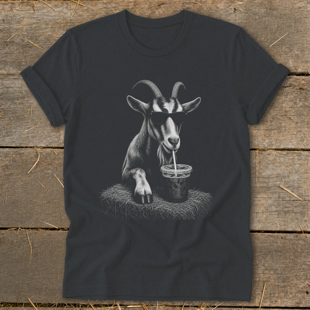 Goat wearing sunglasses drinks from a cup with a straw, graphic on a t-shirt.