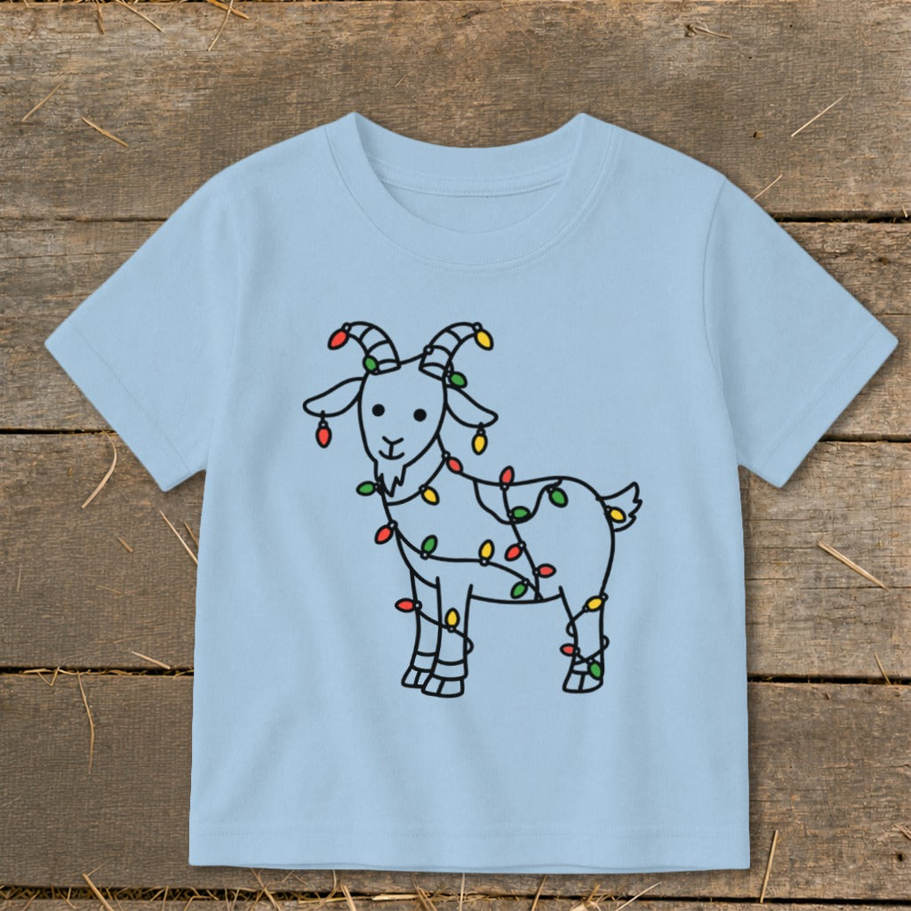 Light blue t-shirt with a black outline drawing of a goat decorated with colorful Christmas lights.