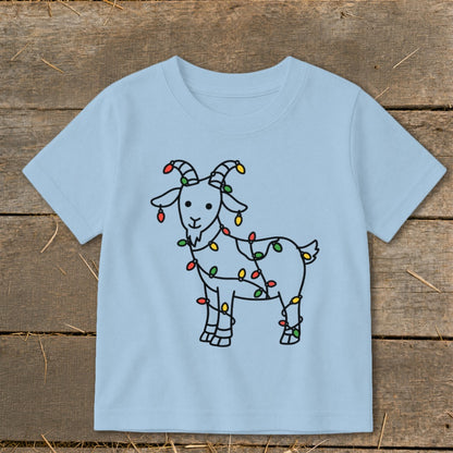 Light blue t-shirt with a black outline drawing of a goat decorated with colorful Christmas lights.