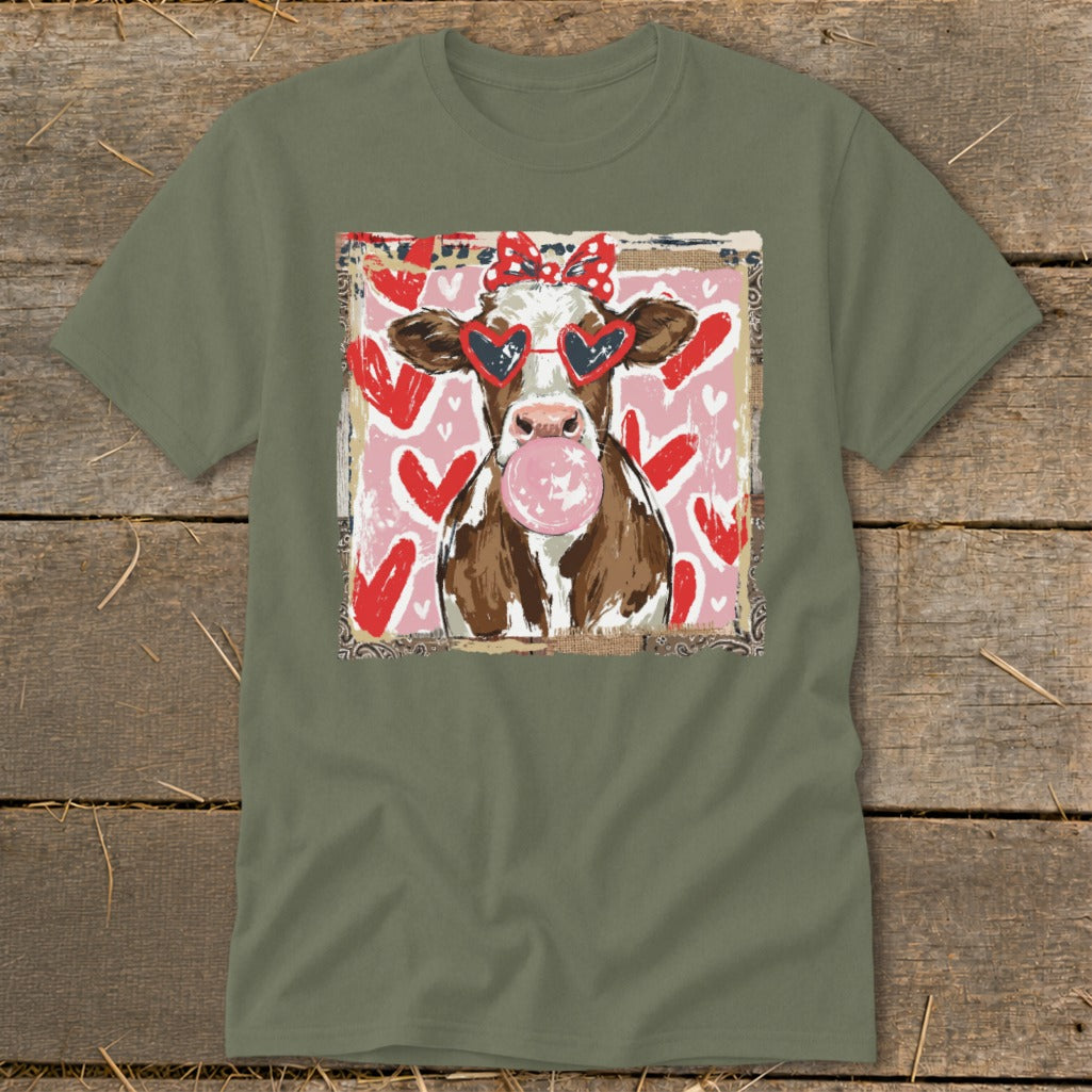 Cow with heart sunglasses, red bow, and bubblegum on a pink heart background.