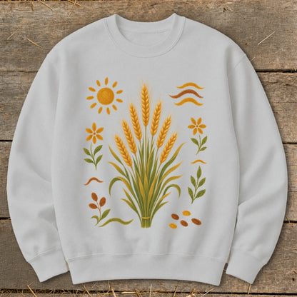 White sweatshirt with a central graphic of wheat stalks surrounded by sun, flowers, leaves, and seeds.