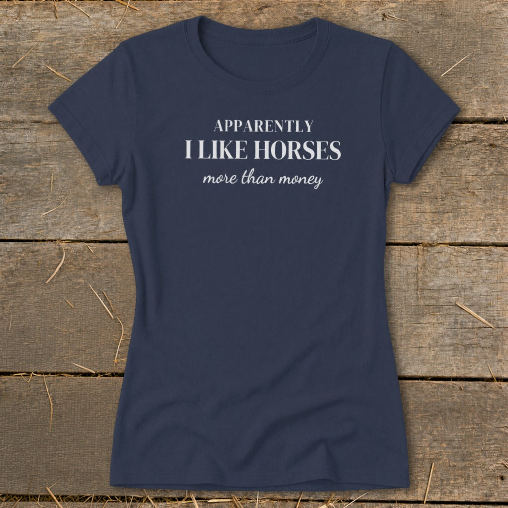 Navy t-shirt with white text: "APPARENTLY I LIKE HORSES more than money"