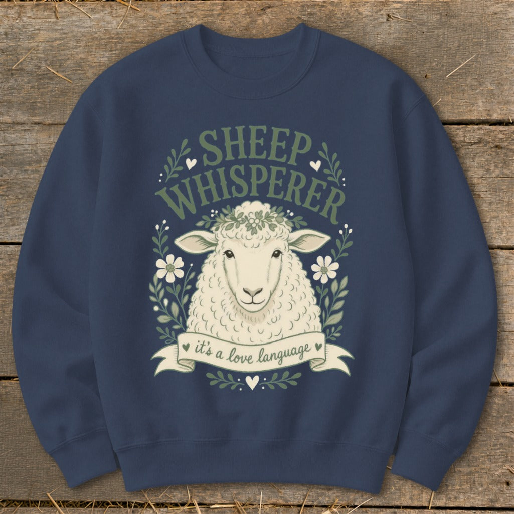 Dark blue sweatshirt with a sheep graphic saying "Sheep Whisperer it's a love language".