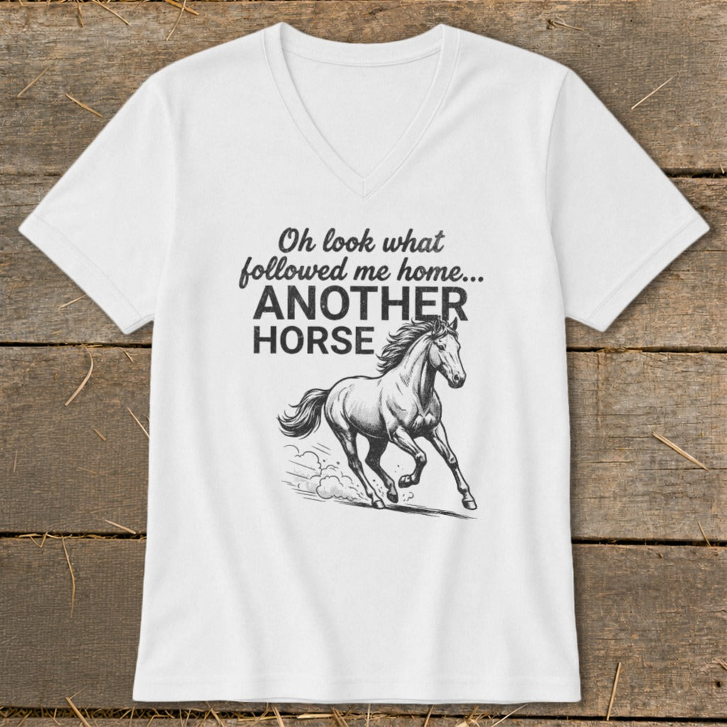 White t-shirt with black graphic of a running horse and text "Oh look what followed me home... ANOTHER HORSE".