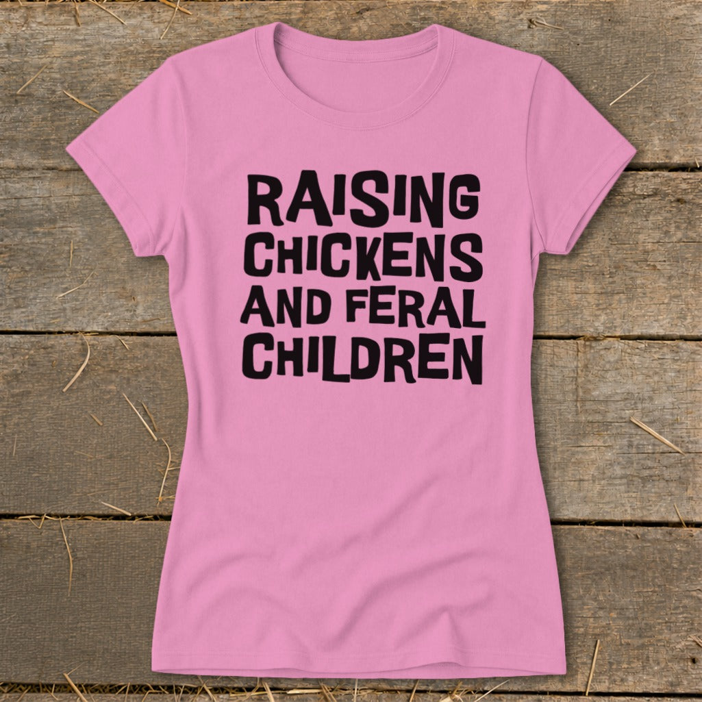 Pink t-shirt with black text that reads "Raising Chickens and Feral Children."