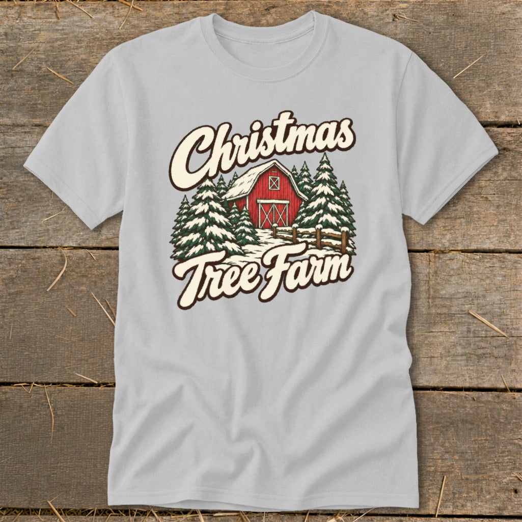 Light gray t-shirt with "Christmas Tree Farm" text over a red barn and snow-covered trees.