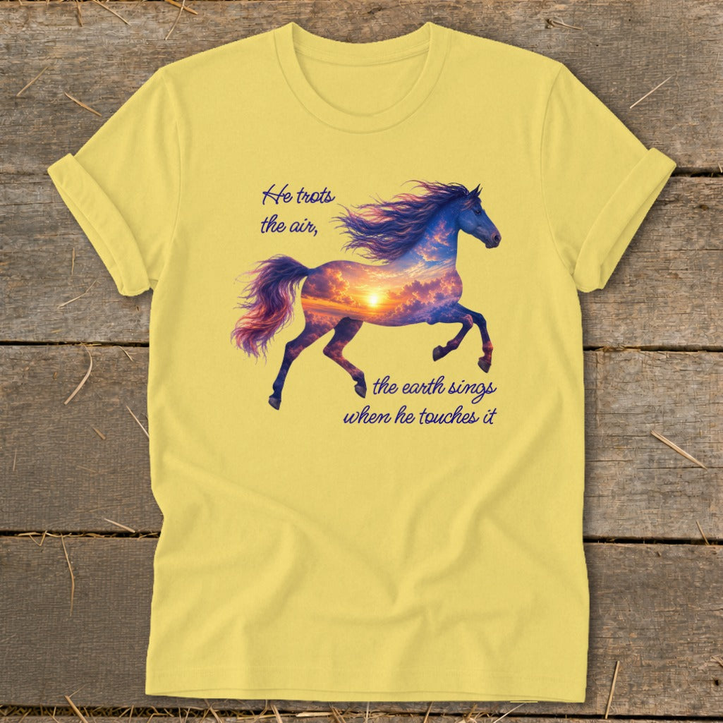 A yellow t-shirt with a graphic of a running horse containing a sunset sky and text.