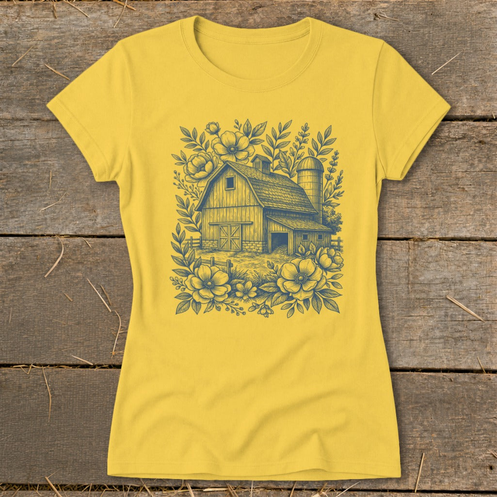 Yellow t-shirt with a detailed barn, silo, and floral line art design.