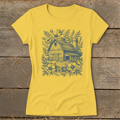 Yellow t-shirt with a detailed barn, silo, and floral line art design.