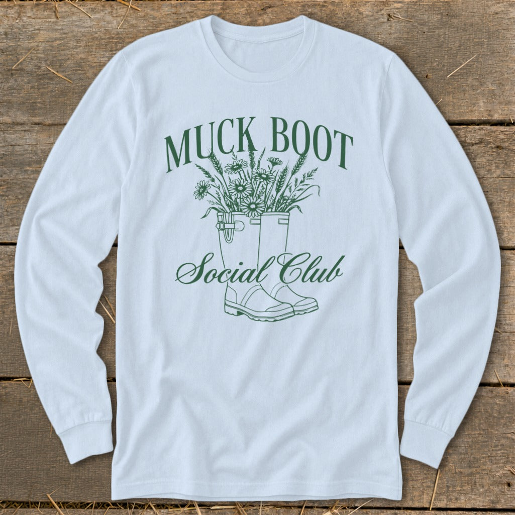 Light blue long-sleeve shirt with "Muck Boot Social Club" graphic.