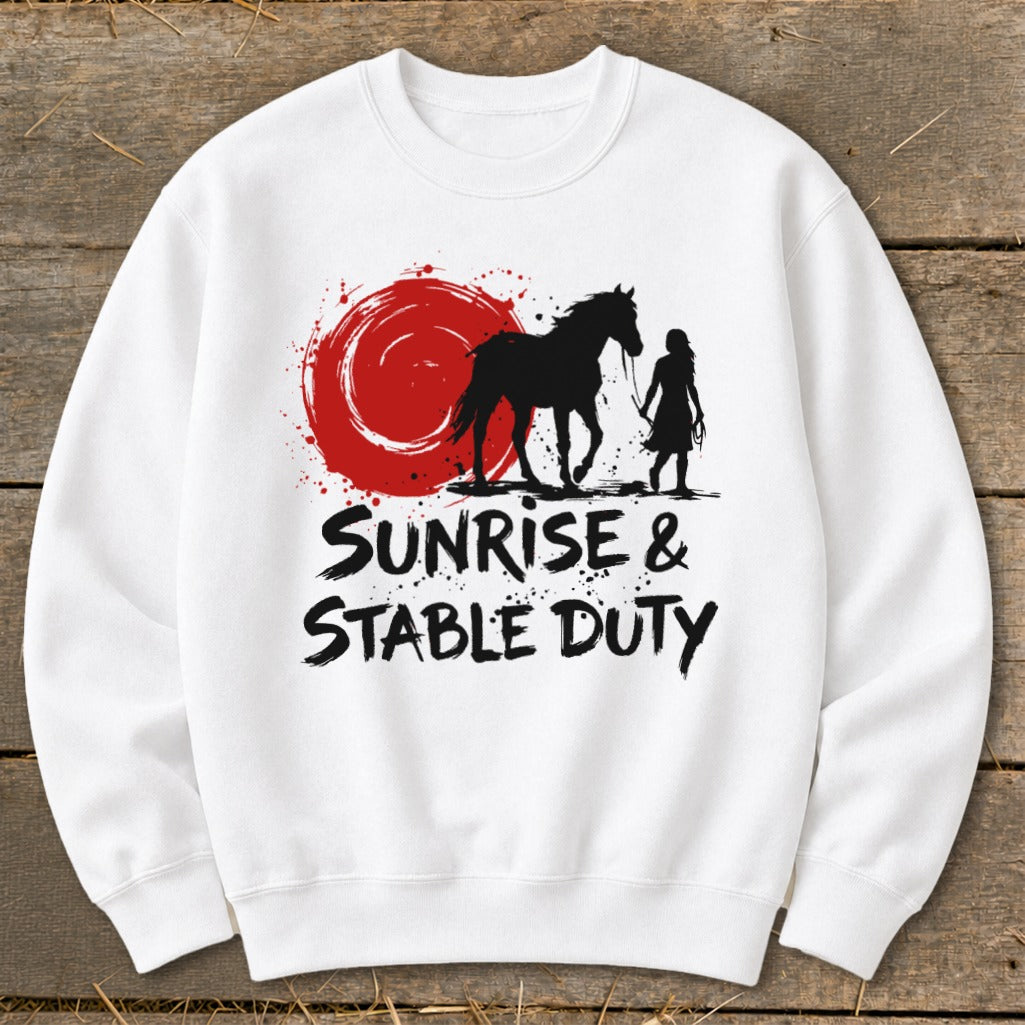 White sweatshirt with black graphic: horse, rider, red sun, and text "SUNRISE & STABLE DUTY".