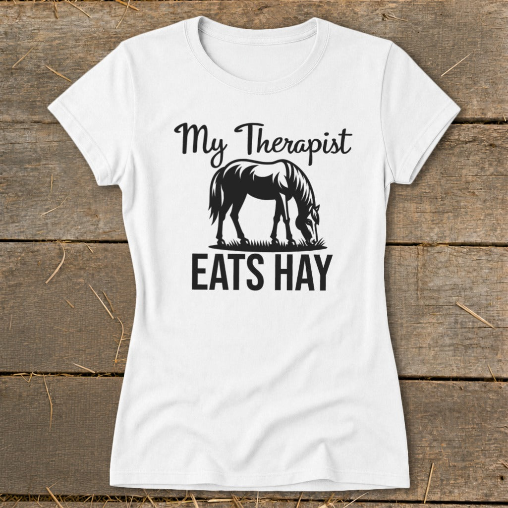 White t-shirt with black text and horse graphic, reading "My Therapist Eats Hay".