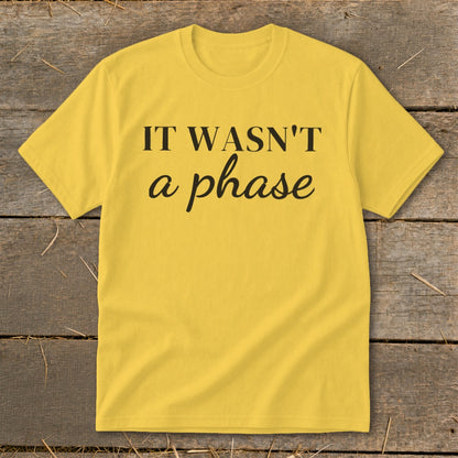 Yellow t-shirt with black text "IT WASN'T a phase".