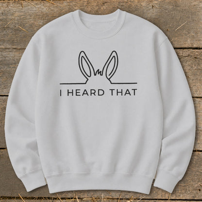 White sweatshirt with black outline of donkey ears and text "I HEARD THAT".