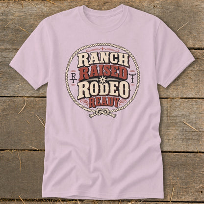 Light pink t-shirt with "Ranch Raised Rodeo Ready" text in a rope circle.