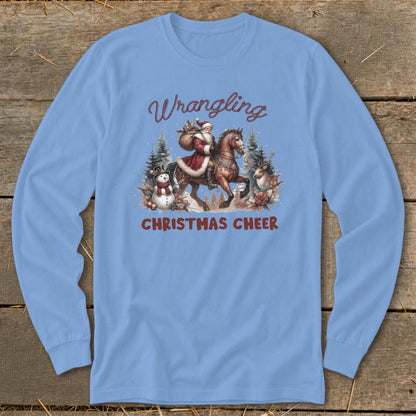 Light blue long sleeve shirt with Santa riding a horse, text "Wrangling Christmas Cheer".