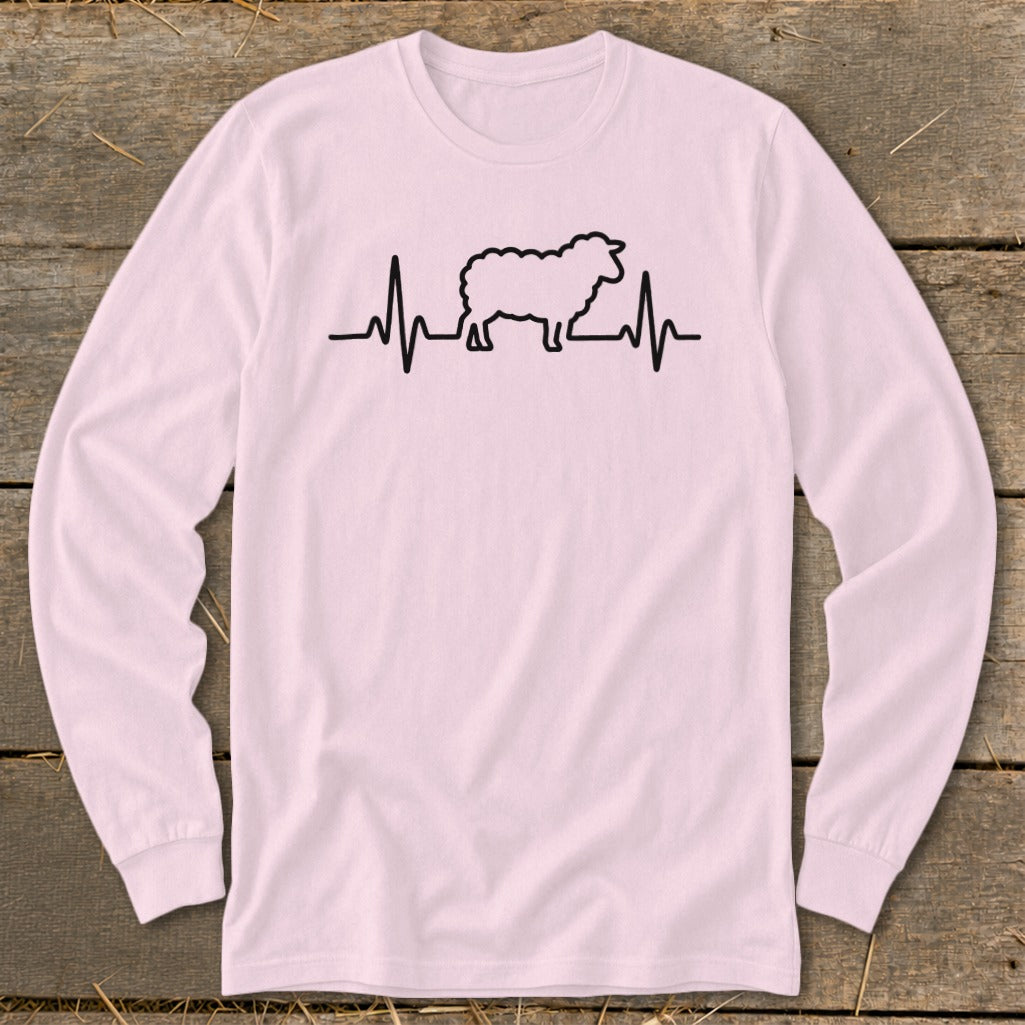 Light pink long-sleeve t-shirt with a black graphic of a sheep integrated into a heartbeat line.