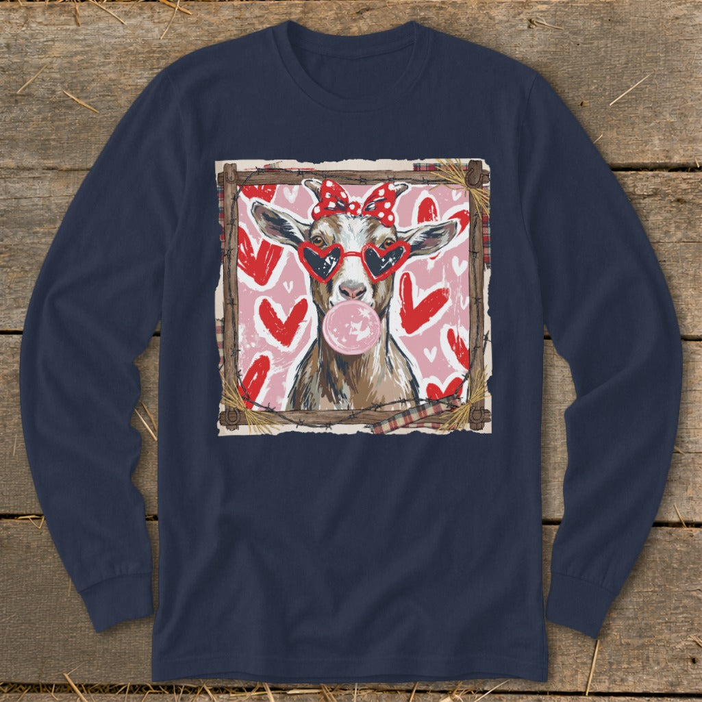 Goat wearing heart sunglasses and red polka dot bow blowing bubble gum.