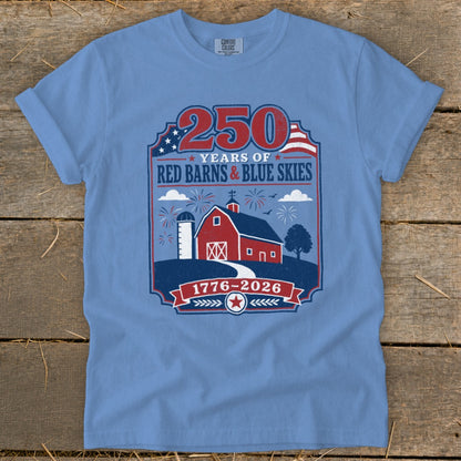 Light blue t-shirt with patriotic farm design saying "250 Years of Red Barns & Blue Skies 1776-2026".