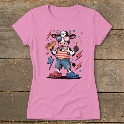 Cartoon cow in sunglasses holding a hot dog with fireworks and lightning bolts.