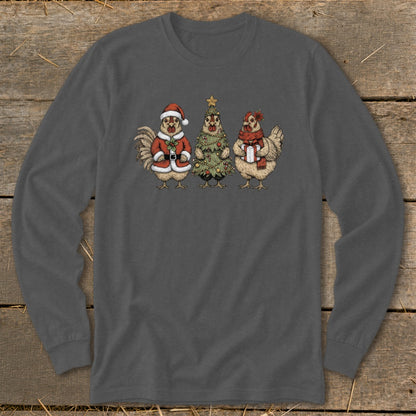 Three chickens dressed for Christmas: one as Santa, one as a tree, one holding a gift.
