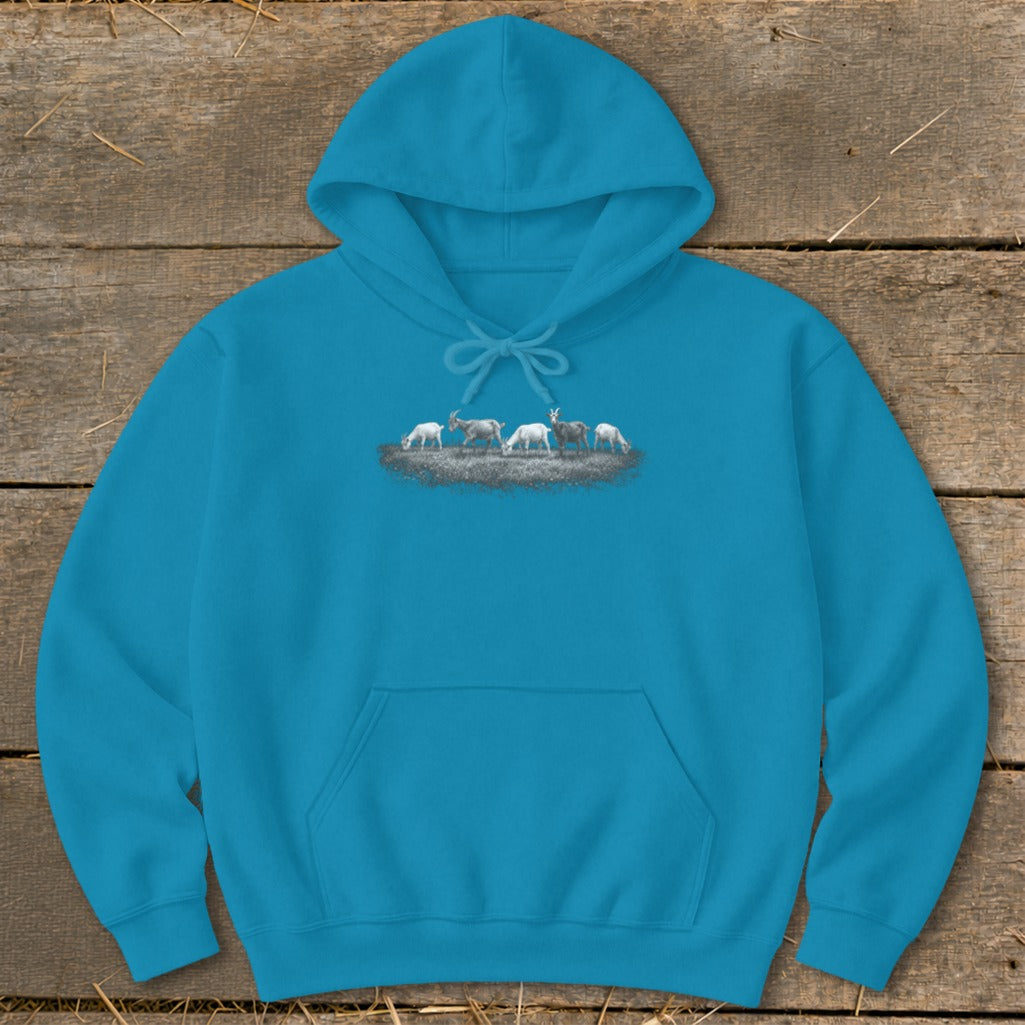 Teal hoodie with a graphic of goats grazing on a patch of grass.