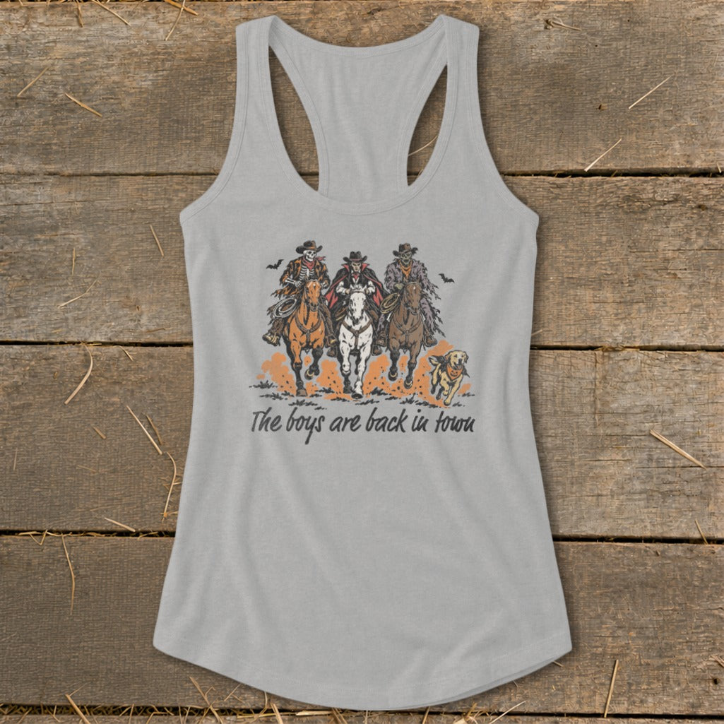 Three spooky cowboys on horses with a dog and text "The boys are back in town".
