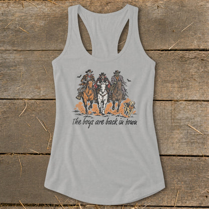 Three spooky cowboys on horses with a dog and text "The boys are back in town".