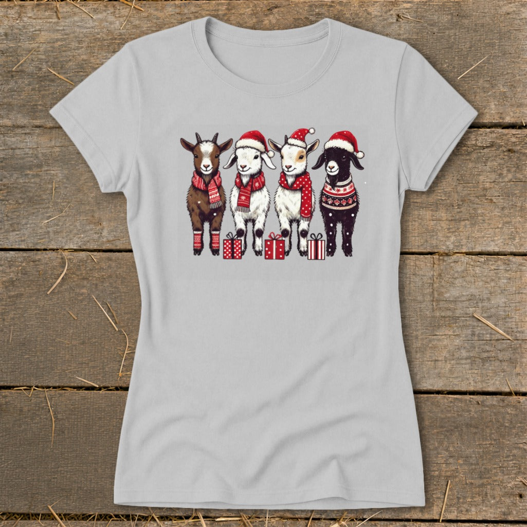Light gray t-shirt with a Christmas graphic of four goats wearing Santa hats and scarves.