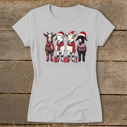 Light gray t-shirt with a Christmas graphic of four goats wearing Santa hats and scarves.