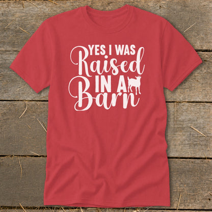 Red t-shirt with white text "YES I WAS Raised IN A Barn" and a goat silhouette.