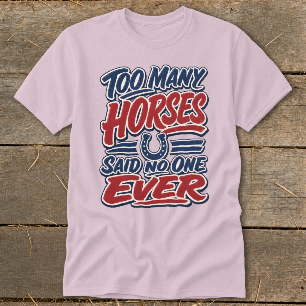 Pink t-shirt with "Too Many Horses Said No One Ever" text and horseshoe graphic.