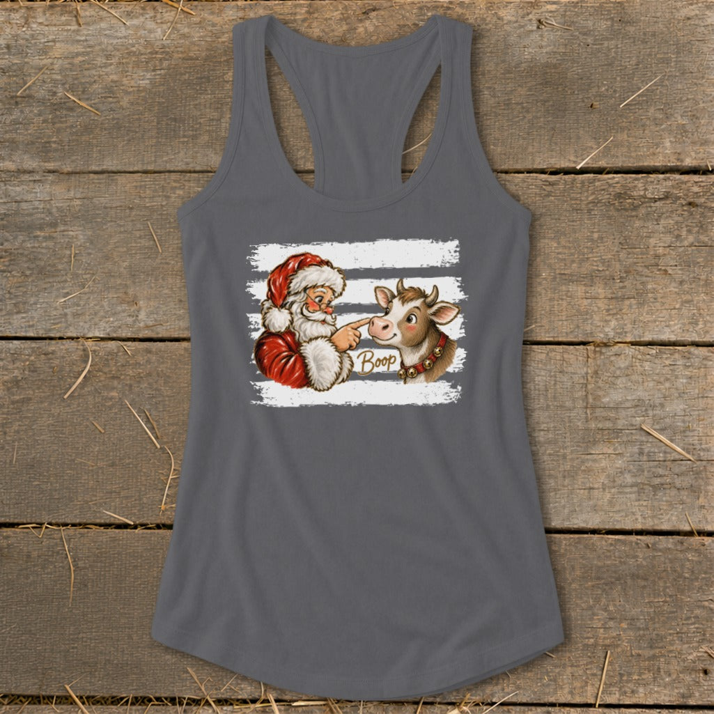 Santa pointing at a cow's nose with the word "Boop" written below.