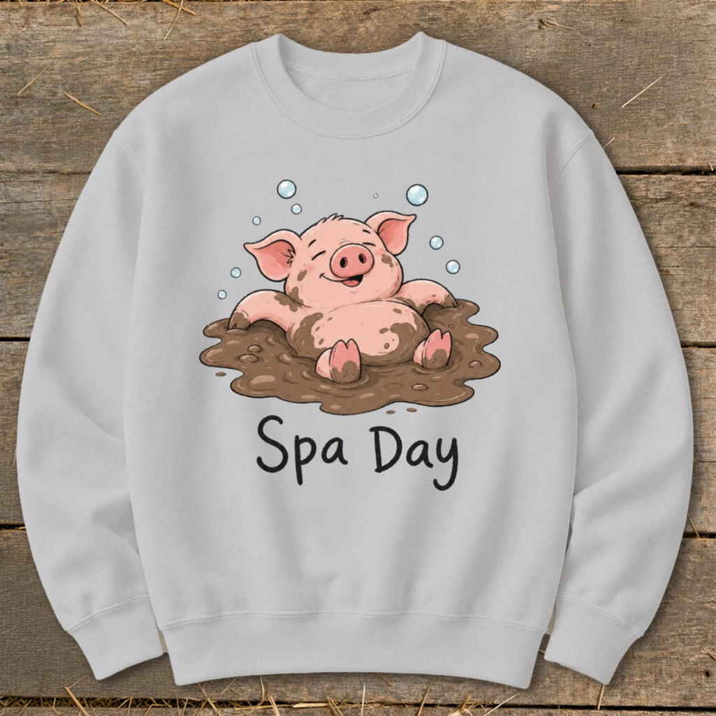 Light grey sweatshirt with a cartoon pig enjoying a mud bath, text "Spa Day" below.
