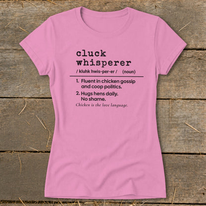 Pink t-shirt with "Cluck Whisperer" definition in black text.