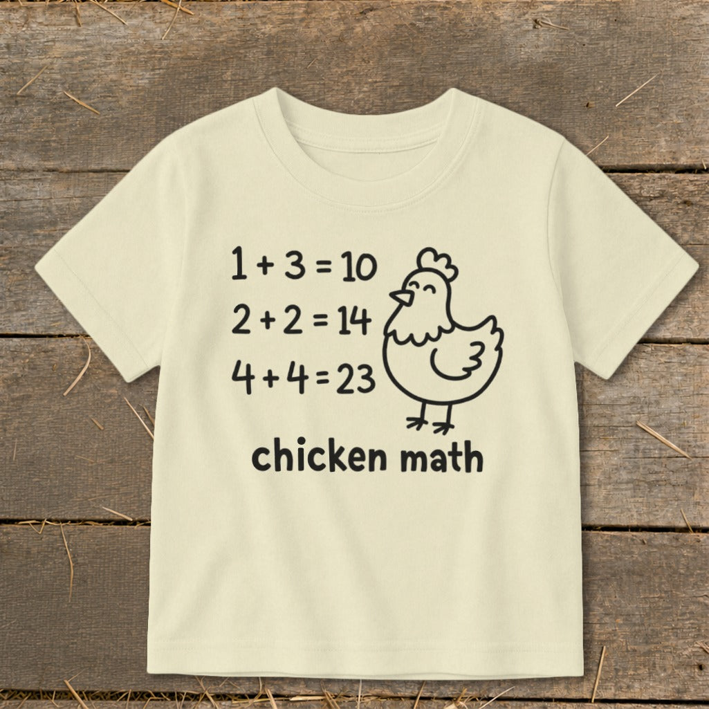 Cream t-shirt with "1 + 3 = 10", "2+2 = 14", "4+4=23", and "chicken math".