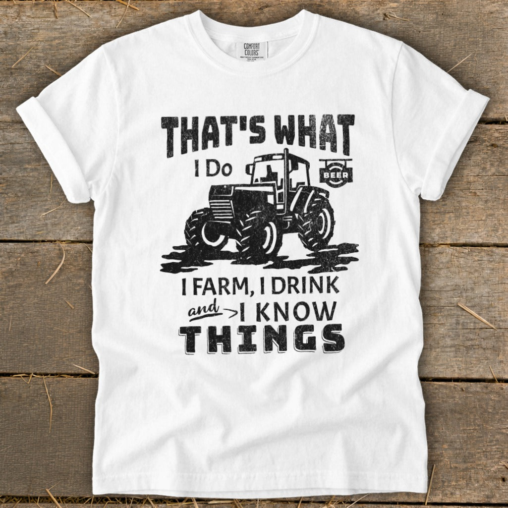 White t-shirt with "That's What I Do, I Farm, I Drink and I Know Things" and tractor graphic.