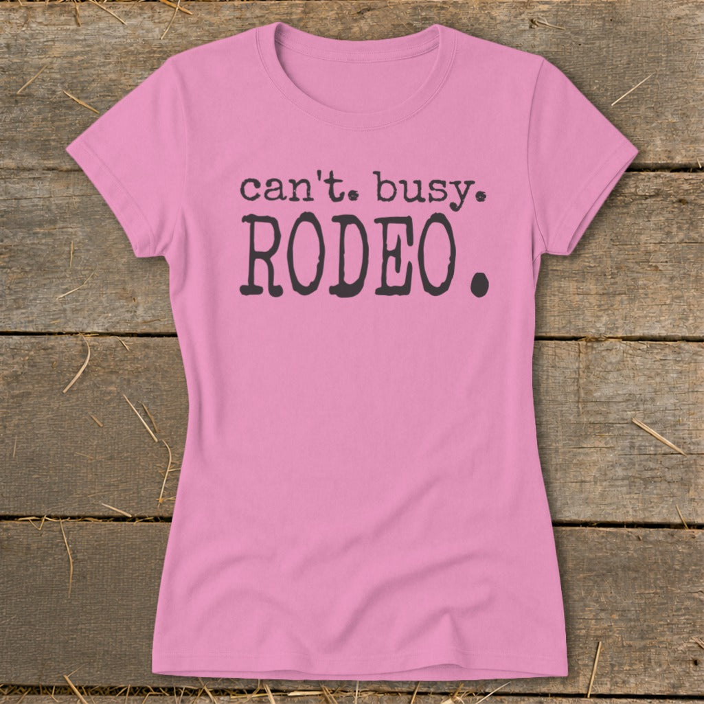 Pink t-shirt with "can't. busy. RODEO." text.