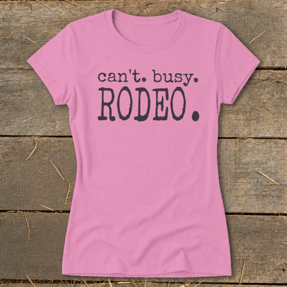 Pink t-shirt with "can't. busy. RODEO." text.