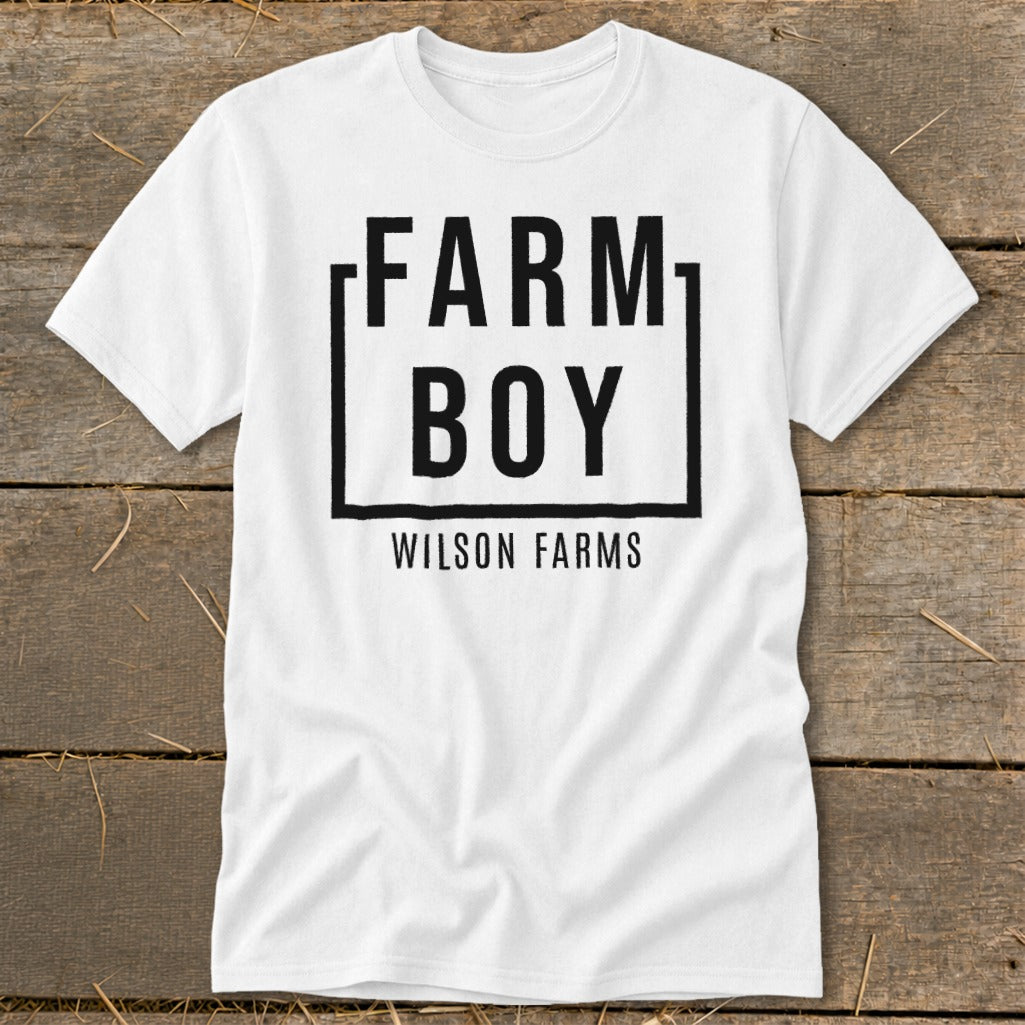 White t-shirt with black text: FARM BOY in a box, below it WILSON FARMS.
