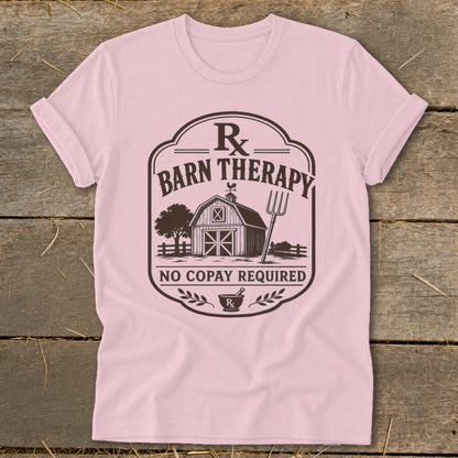 Pink t-shirt with "Barn Therapy" graphic and a barn, tree, and pitchfork illustration.