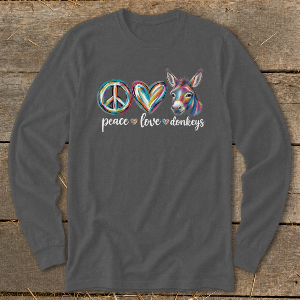 Long sleeve t-shirt with peace, heart, and colorful donkey graphic reading "peace love donkeys."