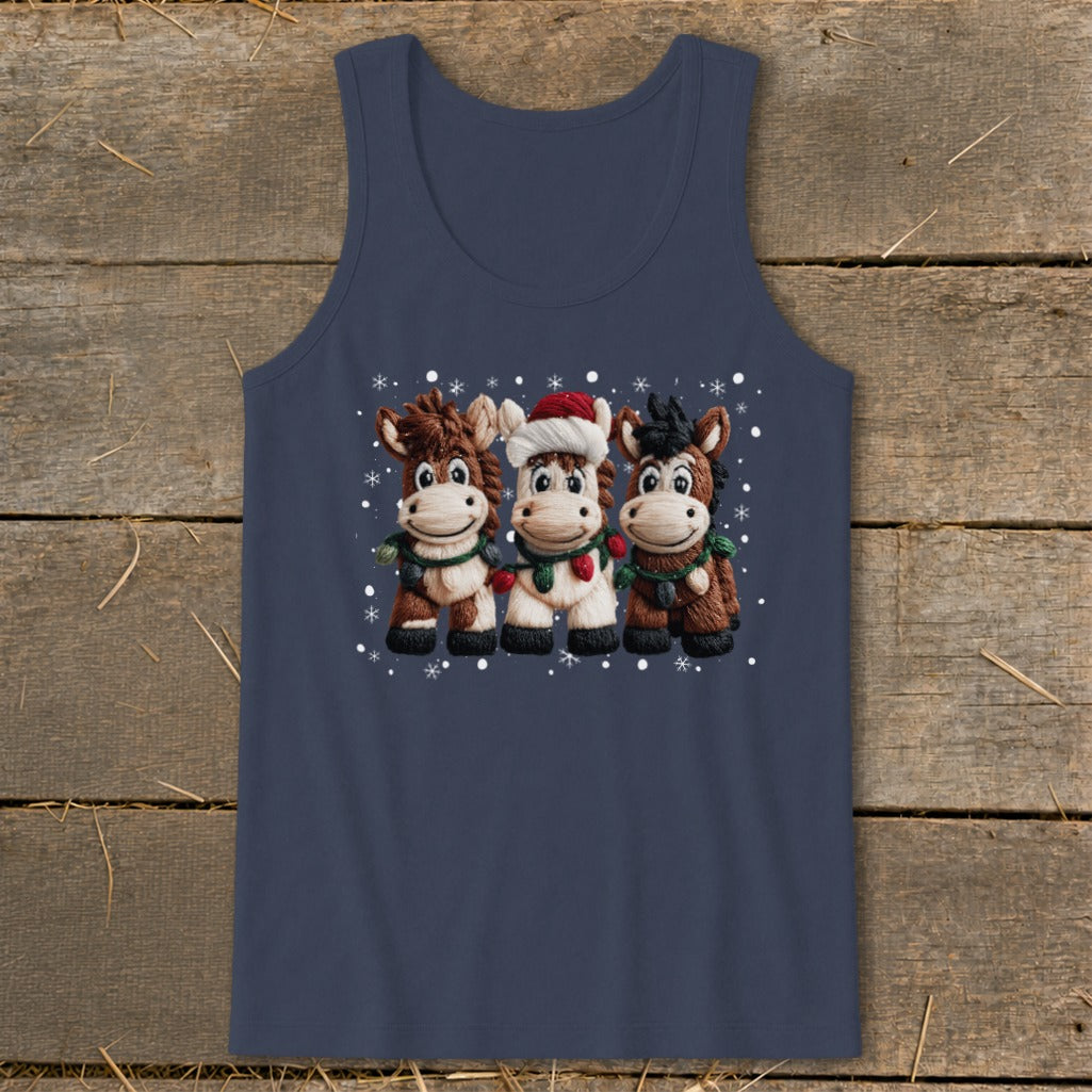 Three cartoon horses in festive attire with snowflakes on a navy tank top.