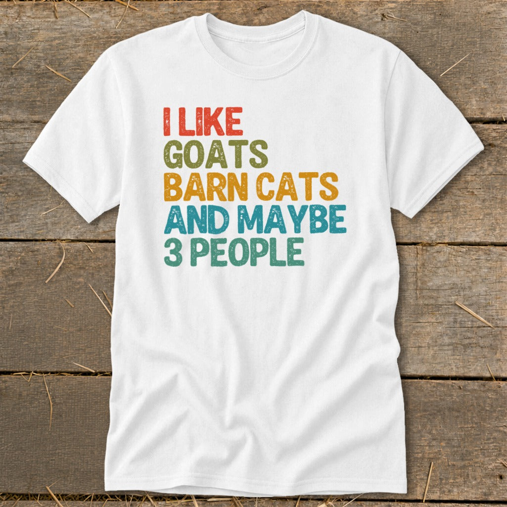 White t-shirt with "I like goats barn cats and maybe 3 people" text.